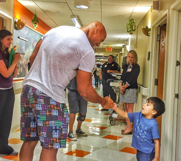Photos from Dwayne "The Rock" Johnson's Charity Work - E! Online  - UK